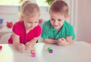 Kids playing with dice