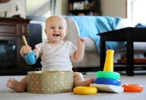 A nine month-old baby playing