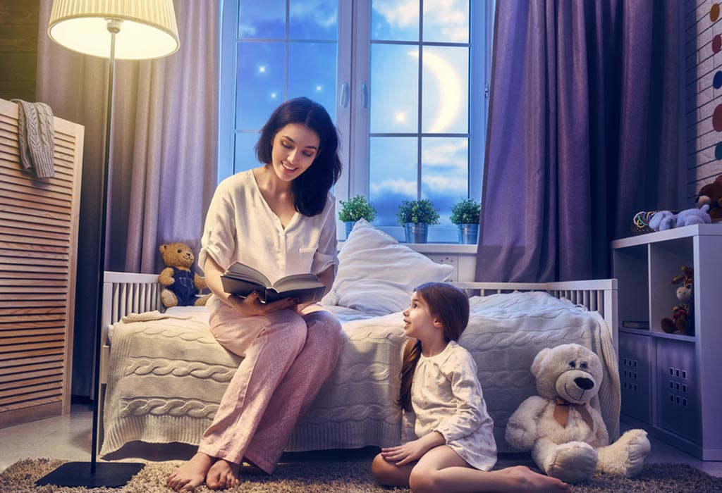 A mother reading out a story to her daughter