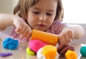 Child playing with modelling clay