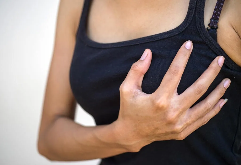 A woman experiencing breast pain