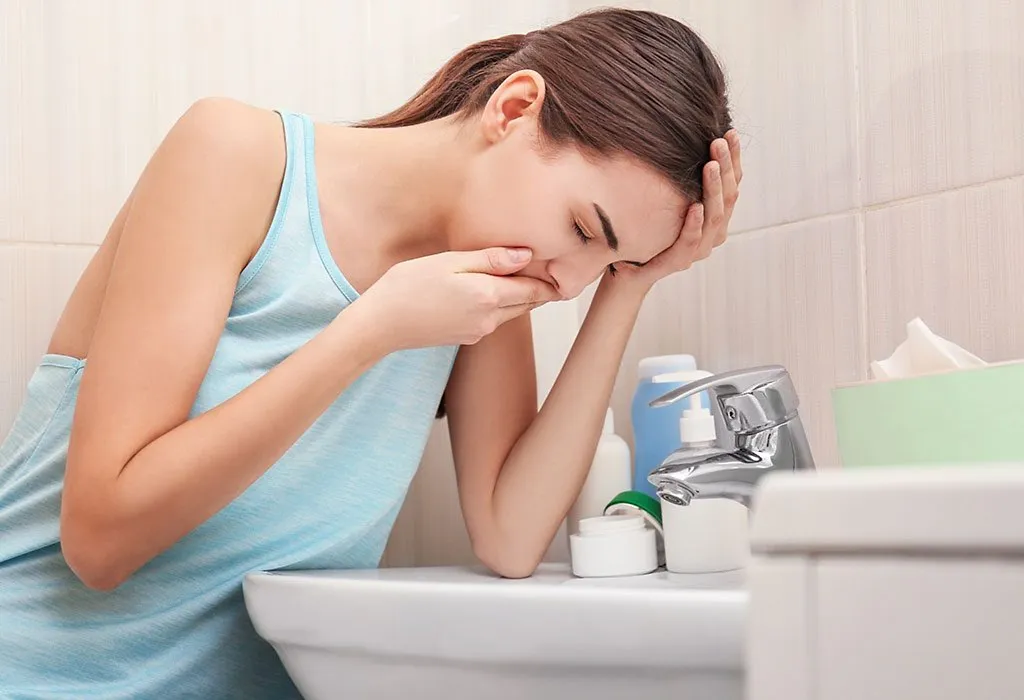 A young woman vomiting