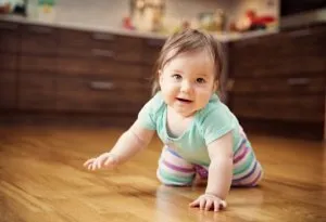 A 7-months-old baby crawling