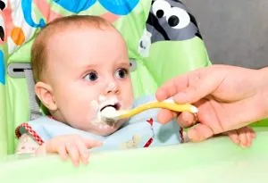 Baby eating yoghurt
