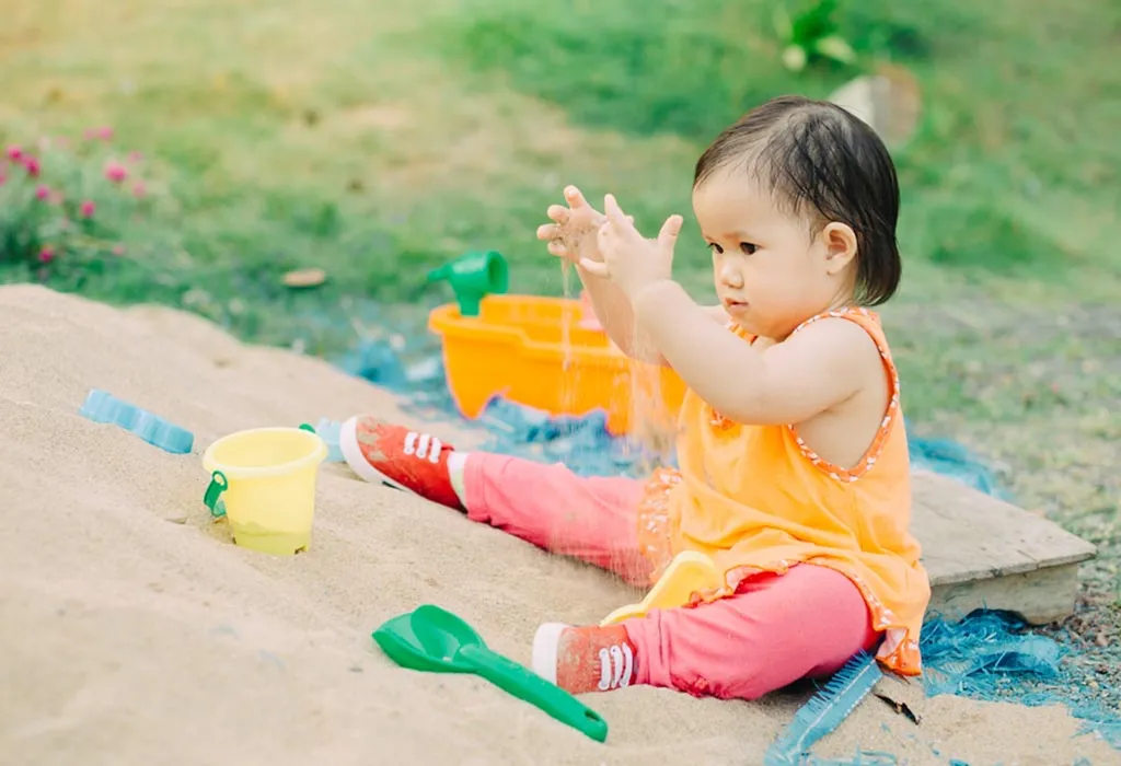A child playing in the sand