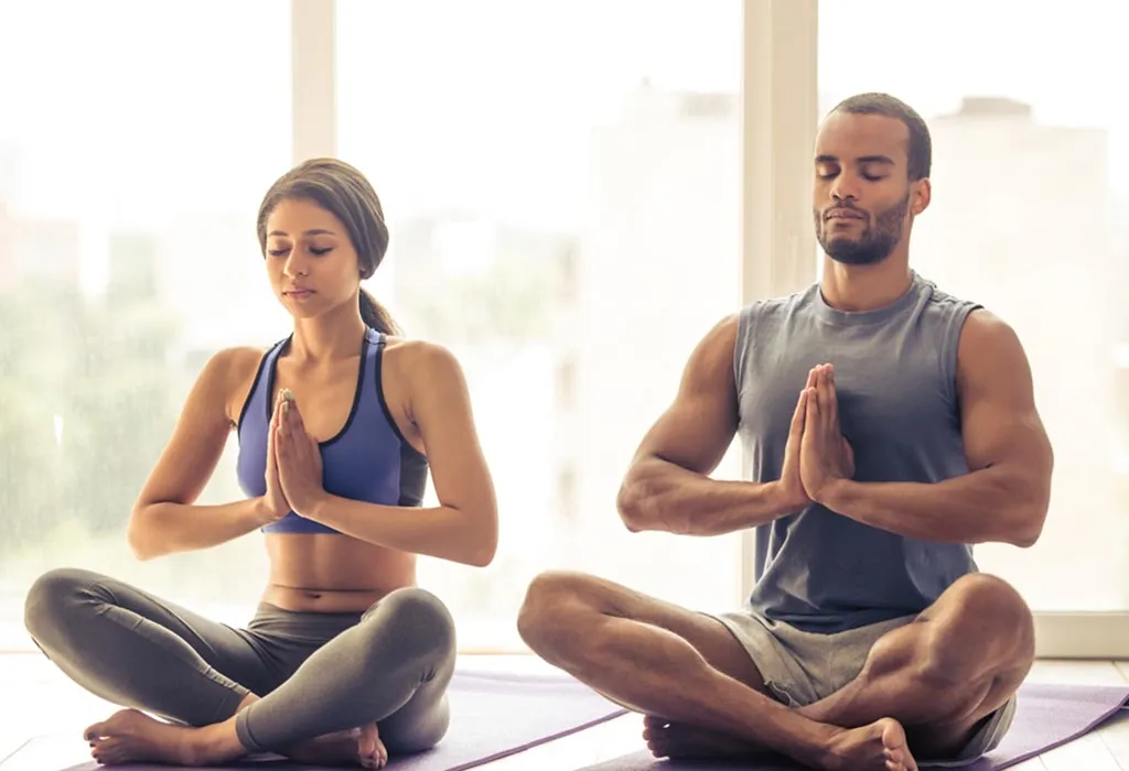 Couple meditating together