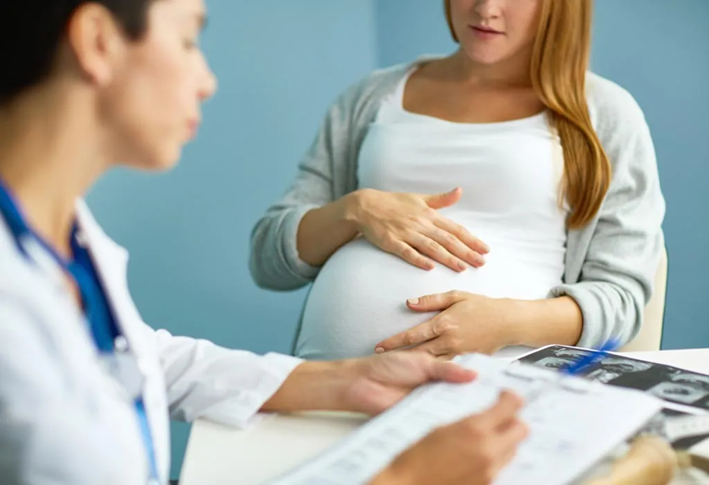 Woman pregnant at doctor