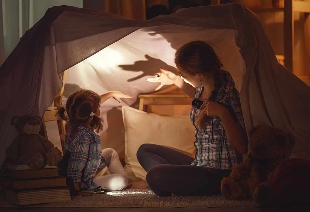Mom telling her daughter a scary story