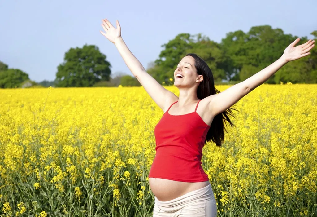 ELATED PREGNANT WOMAN