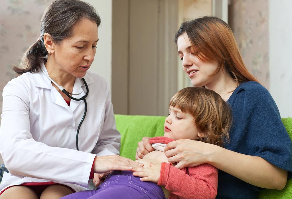 A doctor checking a little girl