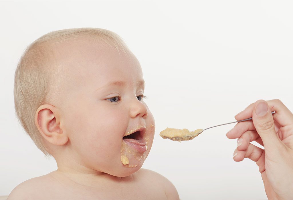 A baby being spoon fed