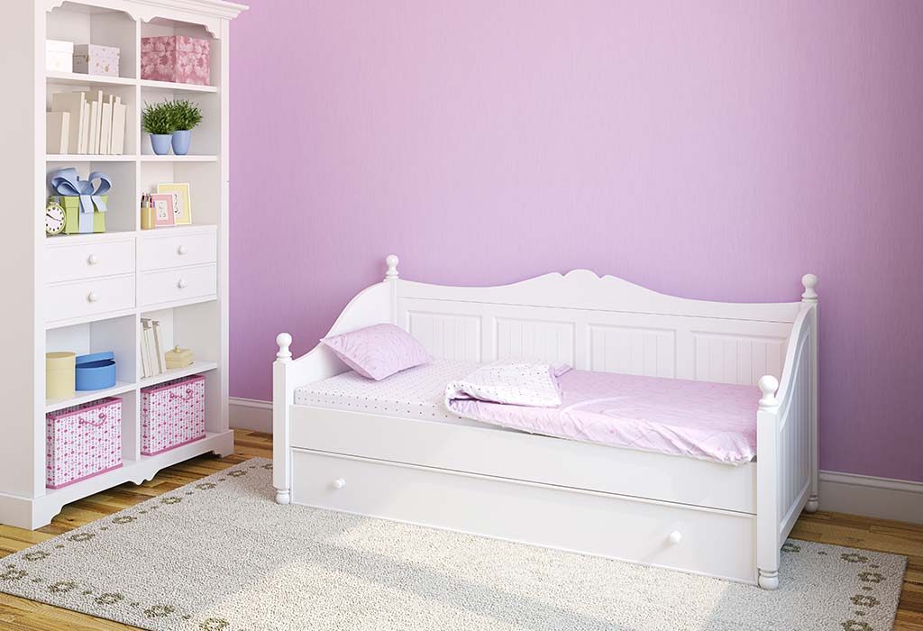 A sofa for parents in a baby's room