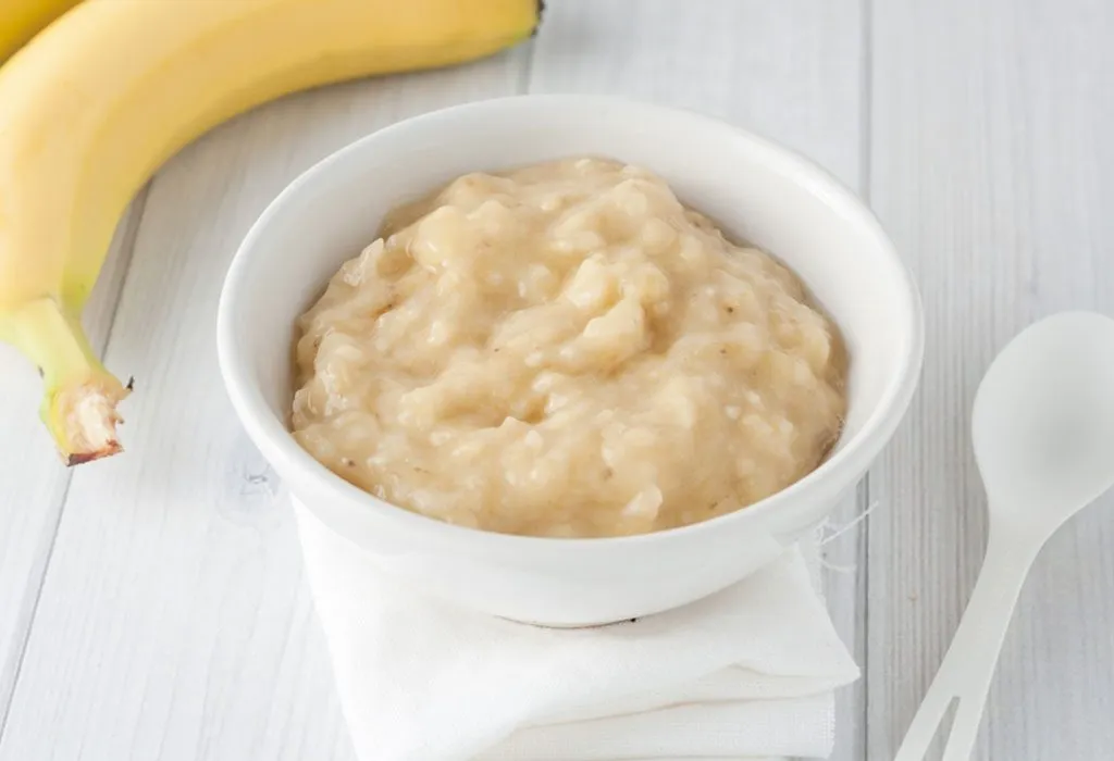 Preparing Baby Food, Homemade. Healthy Smashed Banana Mixed with