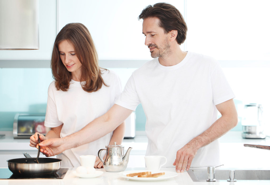 Husband and wife cook together