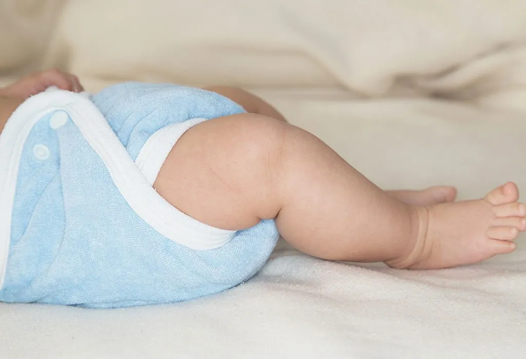 A baby wearing a cloth diaper