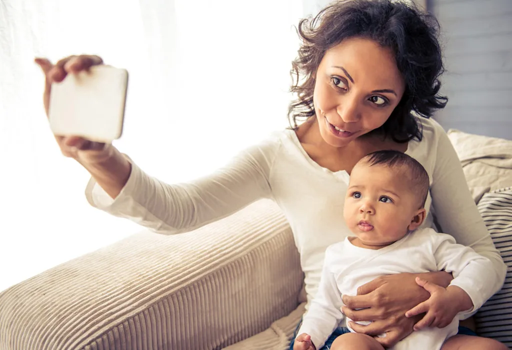 Mom clicking selfie with child