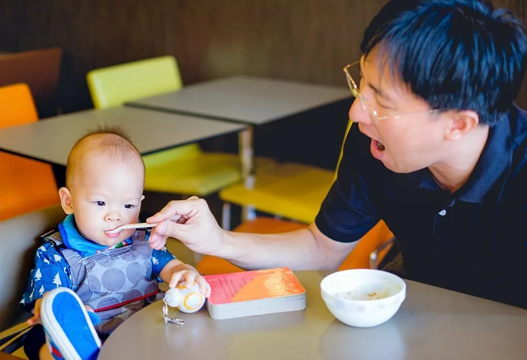 A baby eating suji porridge