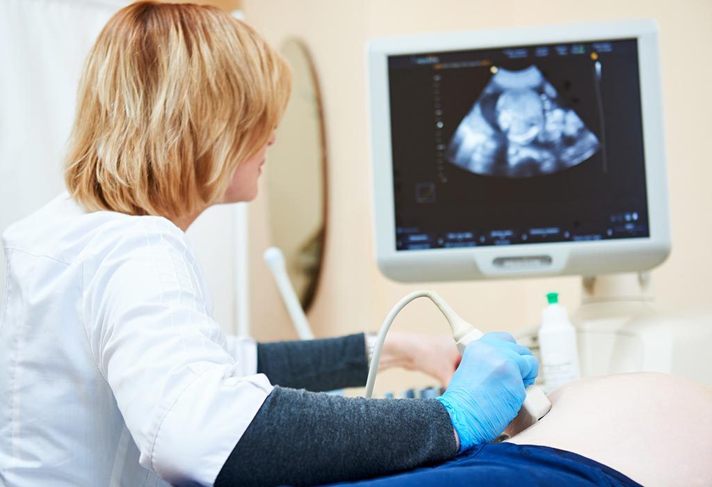 A doctor performing ultrasound scan