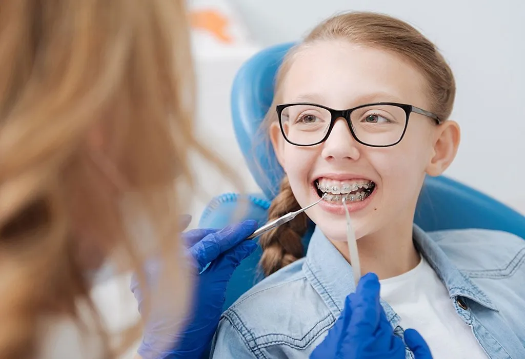 A child getting braces at dentist's place