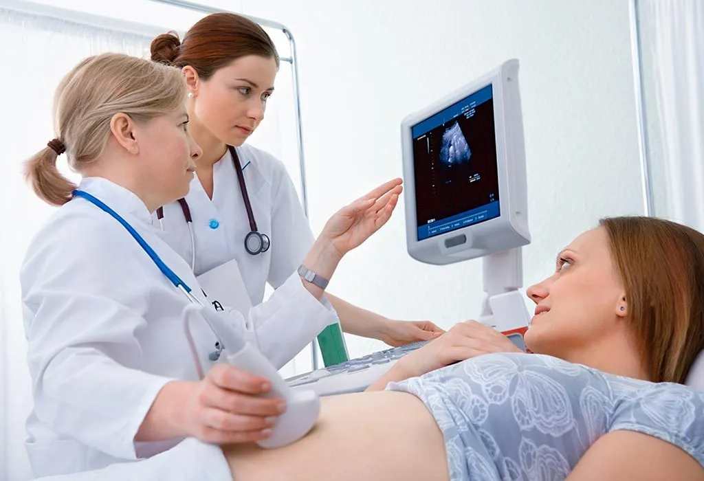 A pregnant woman getting an ultrasound scan