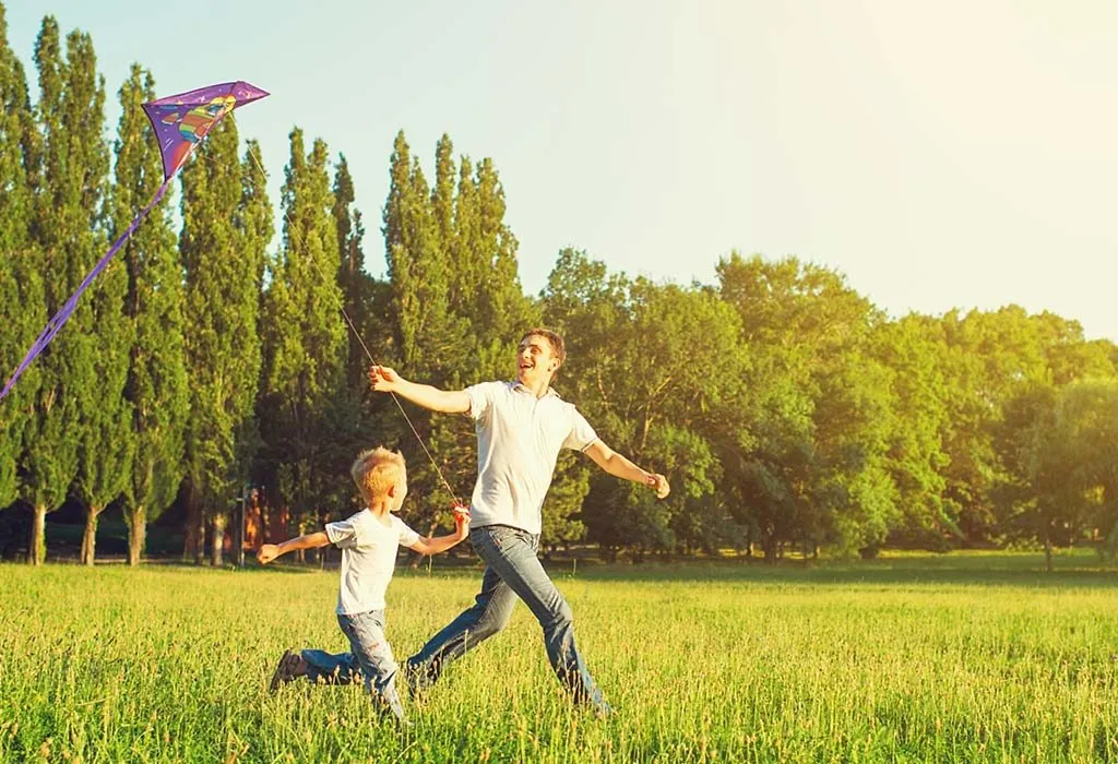 A father and son flying a kite