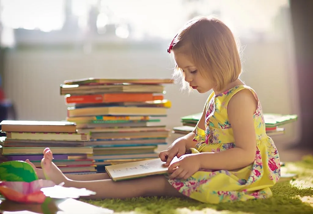 A little girl reading a book