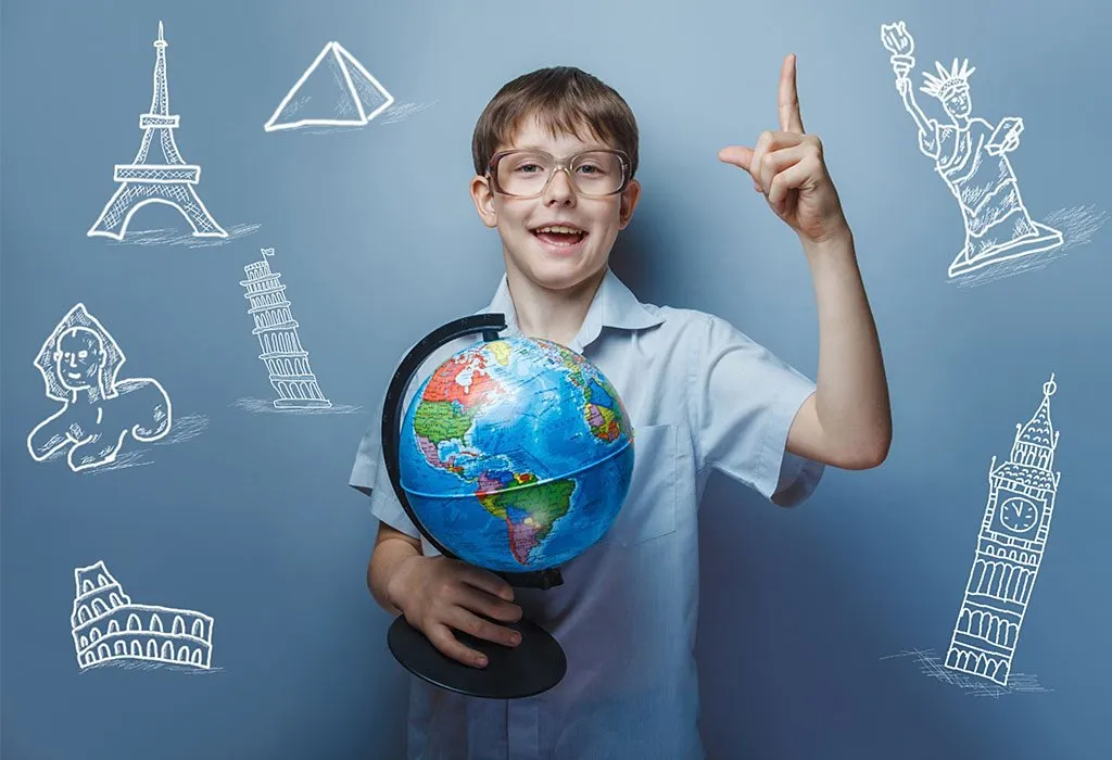 A boy holding a globe