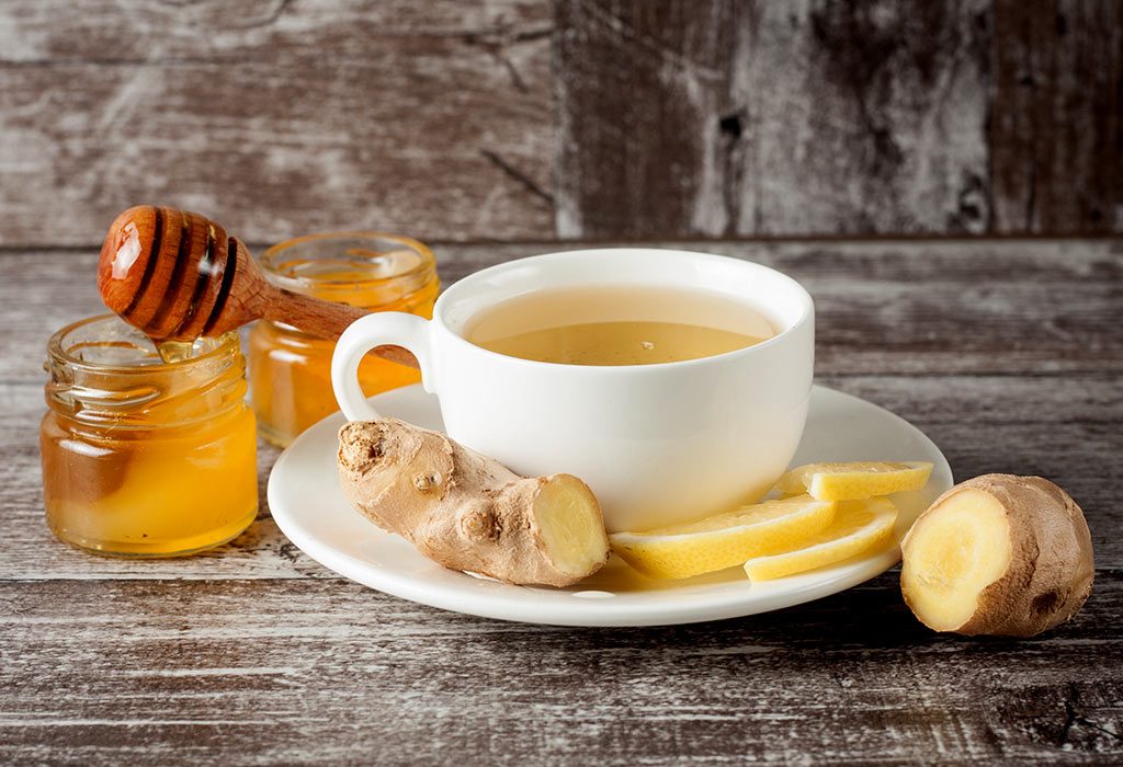 A cup of ginger tea with honey and lemon