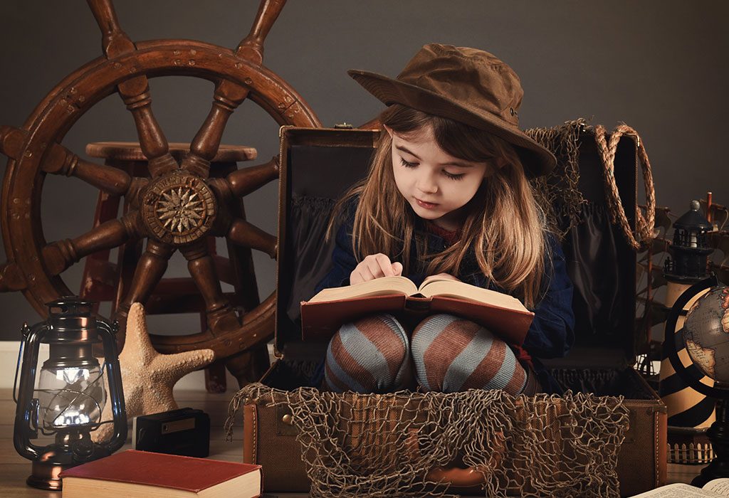 A little girl studying from a history book