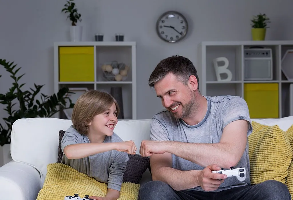 Happy Little Cute Kid Playing Video Game. the Boy Has Addiction To