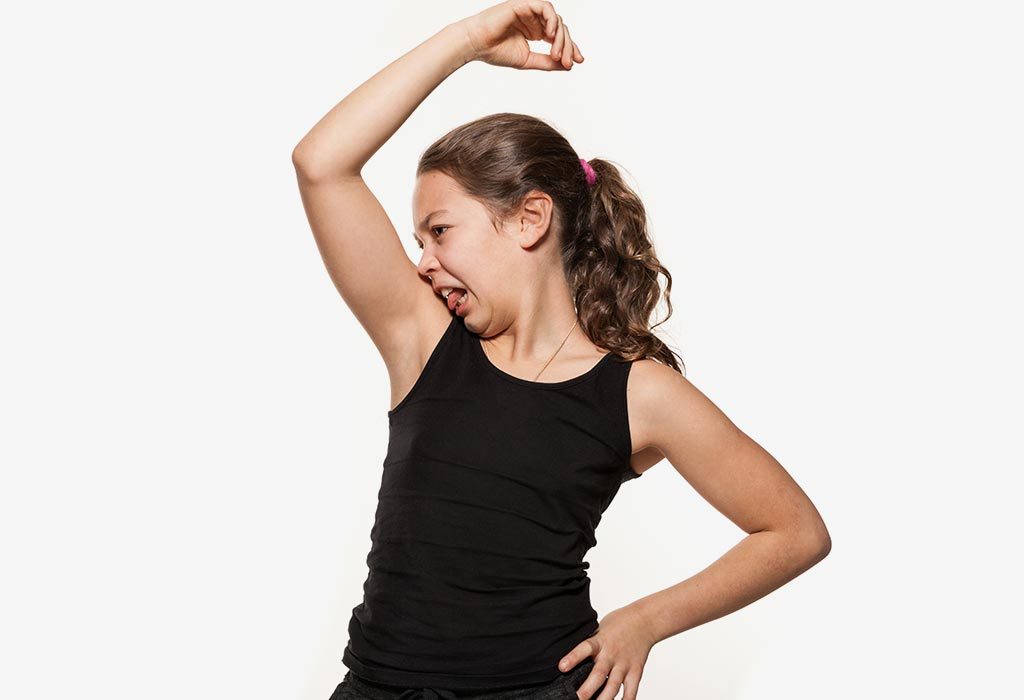 A girl smelling her armpits