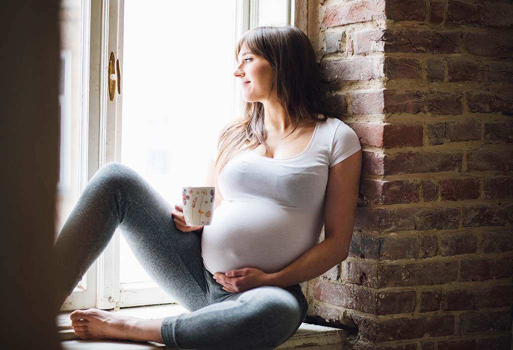 Pregnant woman in light clothes