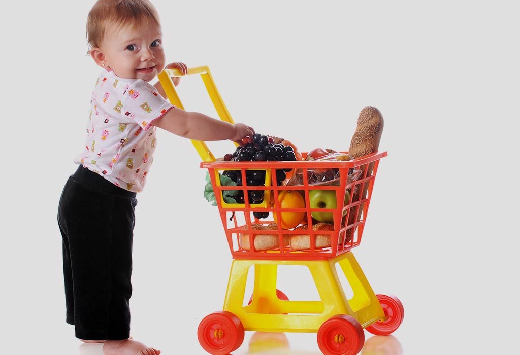 A child with a toy cart
