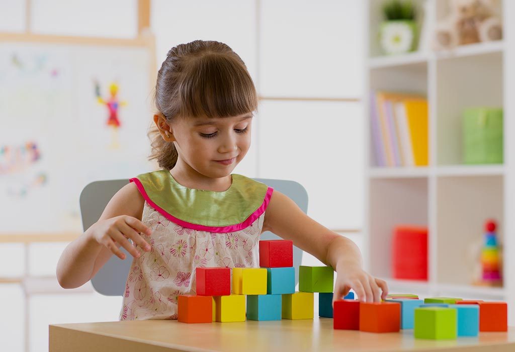  A girl playing with blocks