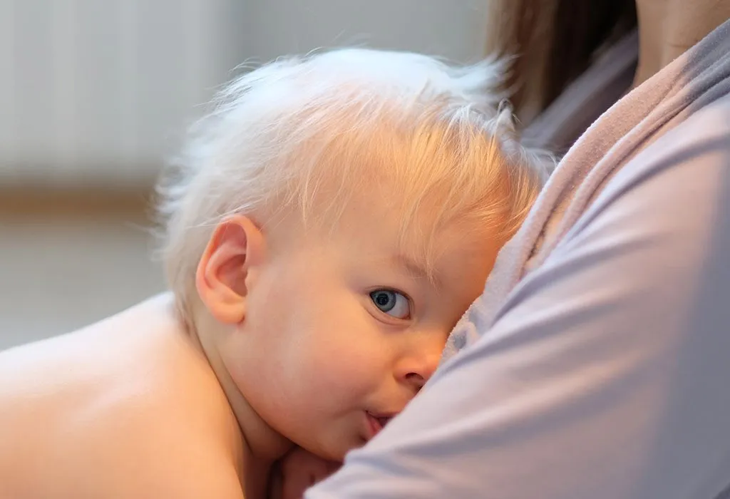 Mother breastfeeding toddler