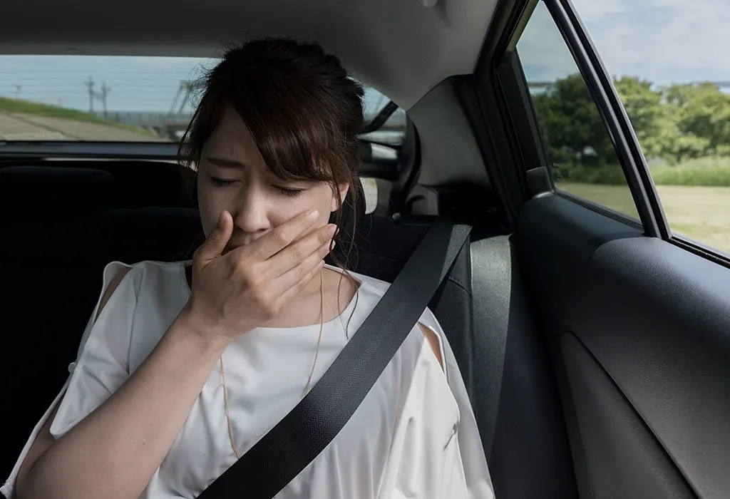 Pregnant woman feeling sick in car