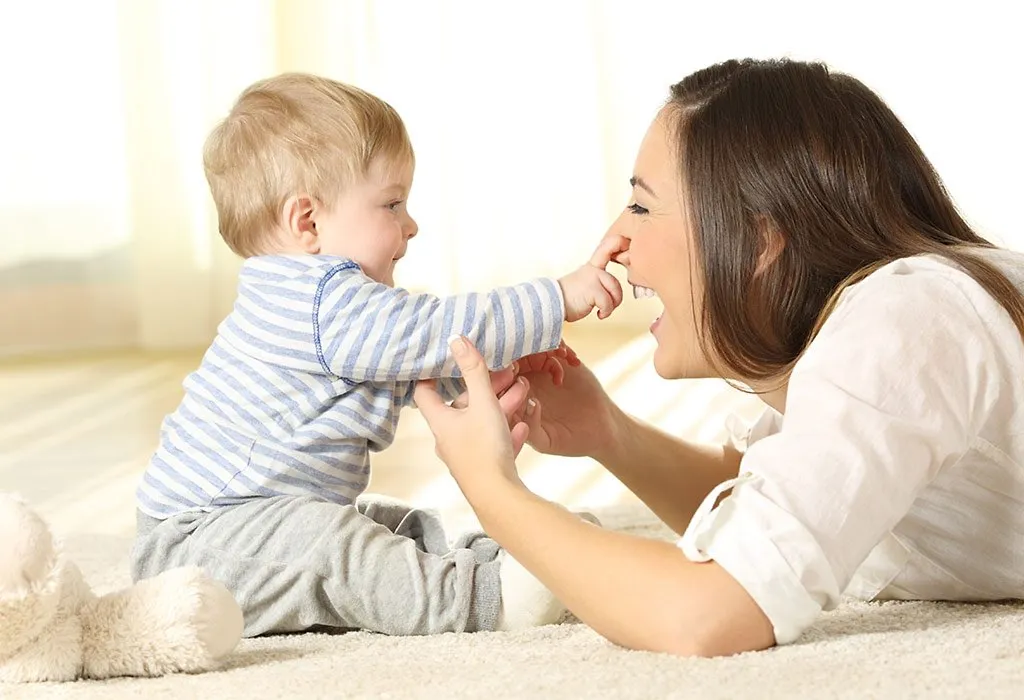A mother playing with her baby