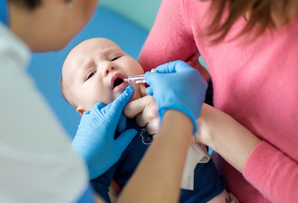 A baby getting an oral vaccine