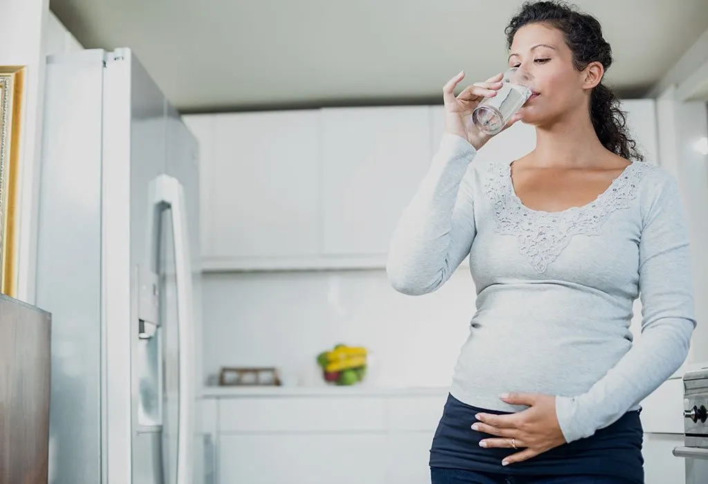 Pregnant woman drinking water