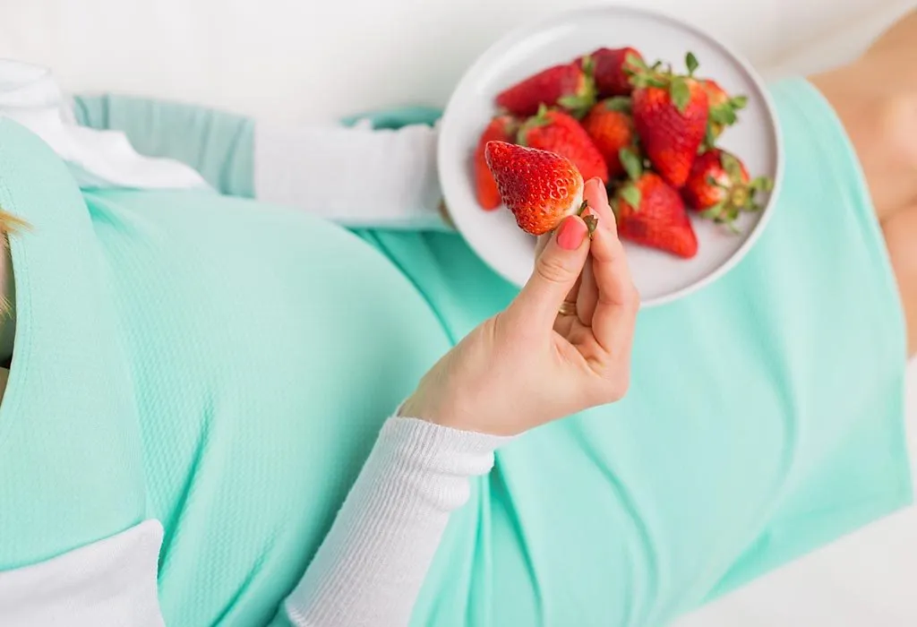 Pregnant Woman Eating Strawberries