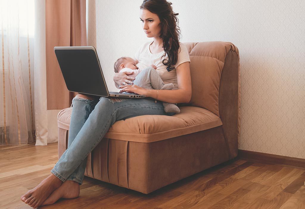 A mom working when breastfeeding