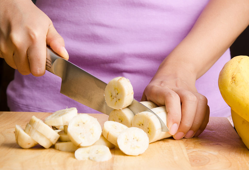 Woman slicing bananas