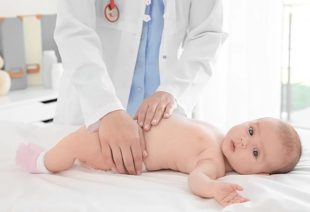 A doctor checking a baby.