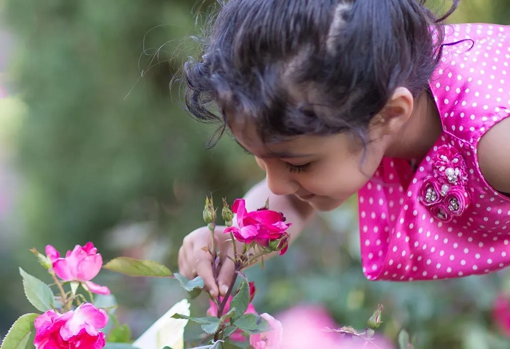 Indian girl picking flowers