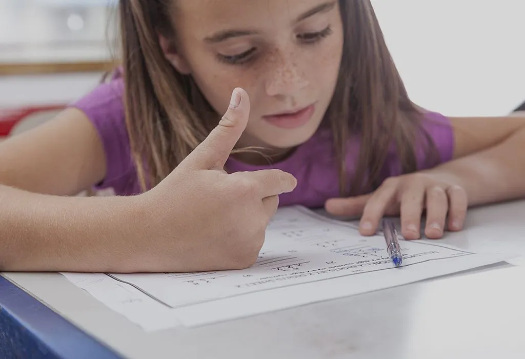Girl solving maths problem