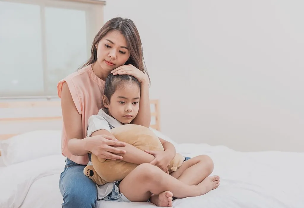 Mother hugging her daughter