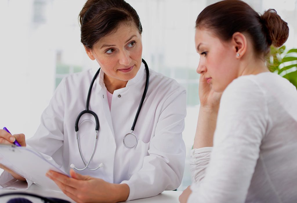 A doctor advising a woman