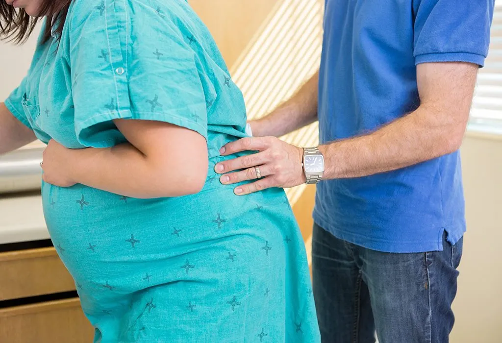 A pregnant woman getting acupressure