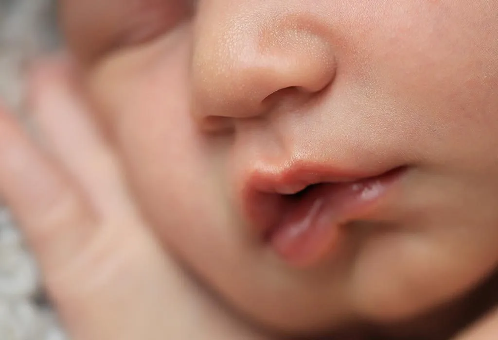 A newborn baby's lips trembling