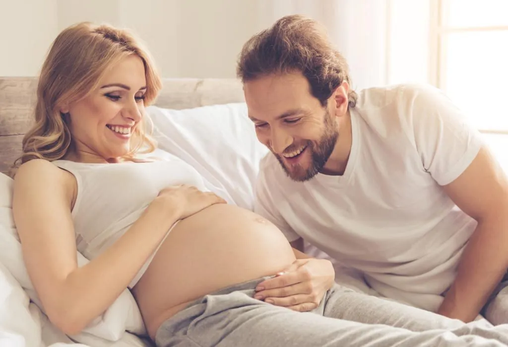 A happy pregnant woman with her husband